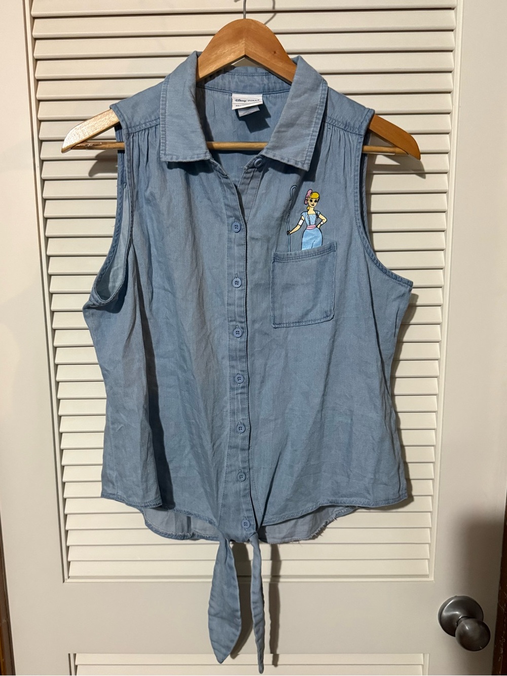 Her Universe Toy Story - Light Blue Sleeveless Tie-Front Button Down Shirt
